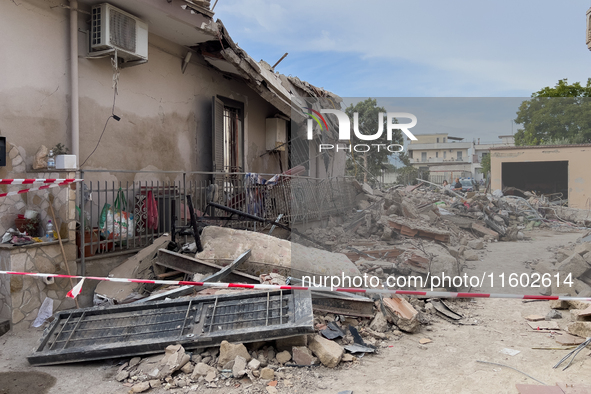 People dig through the rubble of a building that collapses in Saviano, near Naples, on Sunday morning. According to initial reconstructions,...