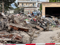 People dig through the rubble of a building that collapses in Saviano, near Naples, on Sunday morning. According to initial reconstructions,...