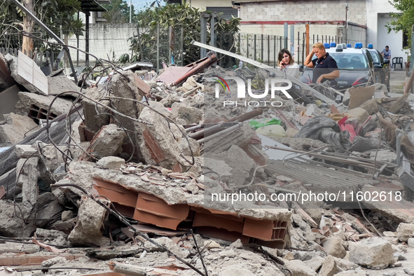 People dig through the rubble of a building that collapses in Saviano, near Naples, on Sunday morning. According to initial reconstructions,...