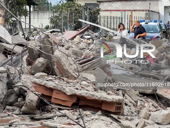 People dig through the rubble of a building that collapses in Saviano, near Naples, on Sunday morning. According to initial reconstructions,...