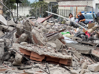 People dig through the rubble of a building that collapses in Saviano, near Naples, on Sunday morning. According to initial reconstructions,...