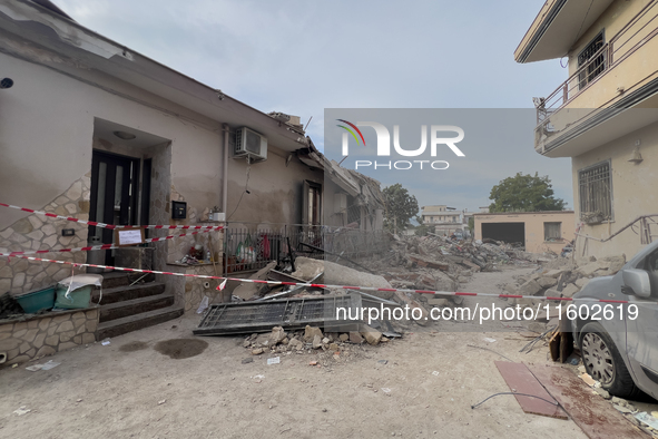 People dig through the rubble of a building that collapses in Saviano, near Naples, on Sunday morning. According to initial reconstructions,...