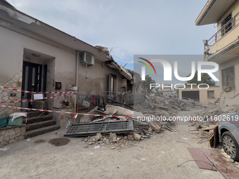 People dig through the rubble of a building that collapses in Saviano, near Naples, on Sunday morning. According to initial reconstructions,...