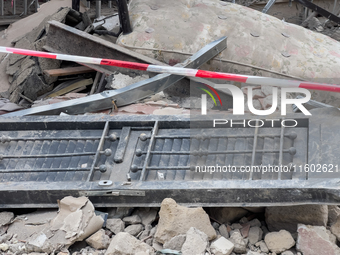 People dig through the rubble of a building that collapses in Saviano, near Naples, on Sunday morning. According to initial reconstructions,...