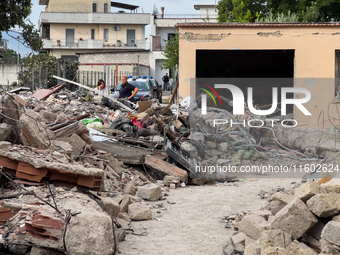 People dig through the rubble of a building that collapses in Saviano, near Naples, on Sunday morning. According to initial reconstructions,...