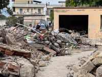 People dig through the rubble of a building that collapses in Saviano, near Naples, on Sunday morning. According to initial reconstructions,...