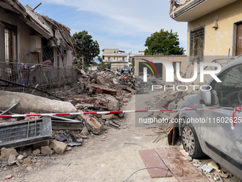 People dig through the rubble of a building that collapses in Saviano, near Naples, on Sunday morning. According to initial reconstructions,...