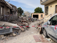 People dig through the rubble of a building that collapses in Saviano, near Naples, on Sunday morning. According to initial reconstructions,...