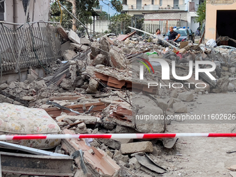 People dig through the rubble of a building that collapses in Saviano, near Naples, on Sunday morning. According to initial reconstructions,...