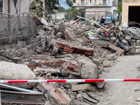 People dig through the rubble of a building that collapses in Saviano, near Naples, on Sunday morning. According to initial reconstructions,...