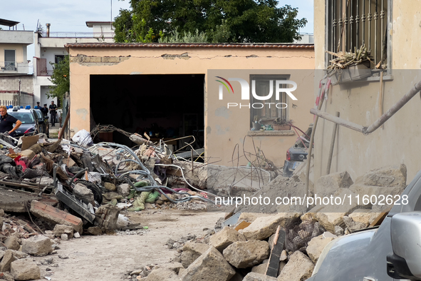 People dig through the rubble of a building that collapses in Saviano, near Naples, on Sunday morning. According to initial reconstructions,...