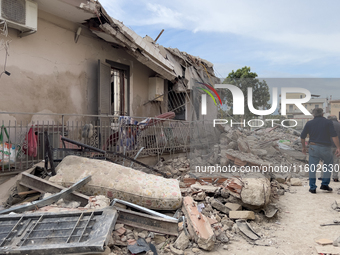 People dig through the rubble of a building that collapses in Saviano, near Naples, on Sunday morning. According to initial reconstructions,...