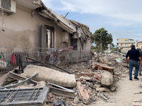 People dig through the rubble of a building that collapses in Saviano, near Naples, on Sunday morning. According to initial reconstructions,...