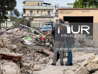 People dig through the rubble of a building that collapses in Saviano, near Naples, on Sunday morning. According to initial reconstructions,...