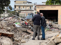 People dig through the rubble of a building that collapses in Saviano, near Naples, on Sunday morning. According to initial reconstructions,...