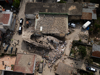 People dig through the rubble of a building that collapses in Saviano, near Naples, on Sunday morning. According to initial reconstructions,...