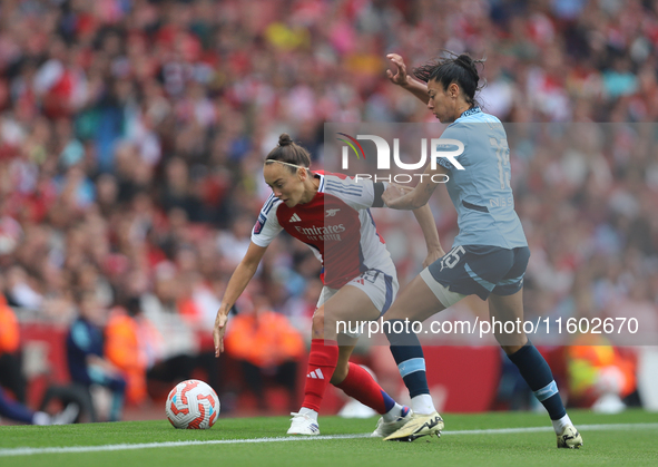 Caitlin Foord and Leila Ouahabi fight for the ball as it goes out of play during the Barclays FA Women's Super League match between Arsenal...