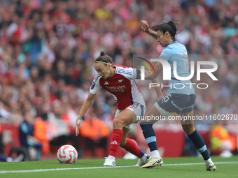 Caitlin Foord and Leila Ouahabi fight for the ball as it goes out of play during the Barclays FA Women's Super League match between Arsenal...