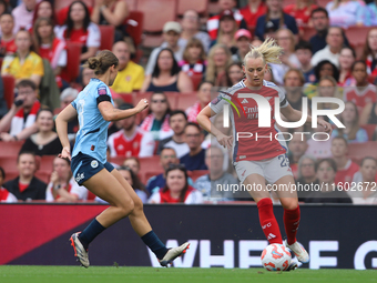 Kerstin Casparij challenges Stina Blackstenius during the Barclays FA Women's Super League match between Arsenal and Manchester City at the...