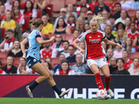 Kerstin Casparij challenges Stina Blackstenius during the Barclays FA Women's Super League match between Arsenal and Manchester City at the...