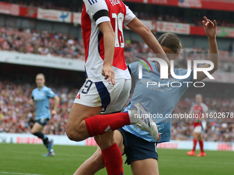 Arsenal's Caitlin Ford is tackled during the Barclays FA Women's Super League match between Arsenal and Manchester City at the Emirates Stad...