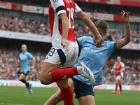 Arsenal's Caitlin Ford is tackled during the Barclays FA Women's Super League match between Arsenal and Manchester City at the Emirates Stad...