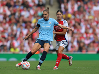 Krya Cooney Cross challenges Vivianne Miedema during the Barclays FA Women's Super League match between Arsenal and Manchester City at the E...