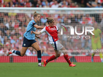 Vivianne Miedema challenges former teammate Kim Little during the Barclays FA Women's Super League match between Arsenal and Manchester City...