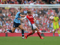 Vivianne Miedema challenges former teammate Kim Little during the Barclays FA Women's Super League match between Arsenal and Manchester City...