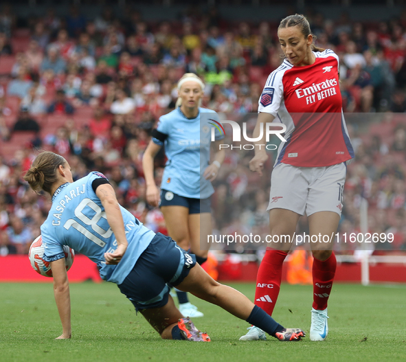 New signing Rosa Kafaji gets challenged by Kerstin Casparij during the Barclays FA Women's Super League match between Arsenal and Manchester...