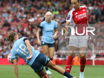 New signing Rosa Kafaji gets challenged by Kerstin Casparij during the Barclays FA Women's Super League match between Arsenal and Manchester...