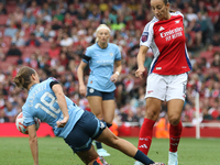 New signing Rosa Kafaji gets challenged by Kerstin Casparij during the Barclays FA Women's Super League match between Arsenal and Manchester...