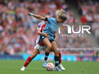 A player tangles during the Barclays FA Women's Super League match between Arsenal and Manchester City at the Emirates Stadium in London, En...