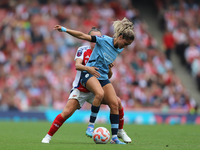 A player tangles during the Barclays FA Women's Super League match between Arsenal and Manchester City at the Emirates Stadium in London, En...