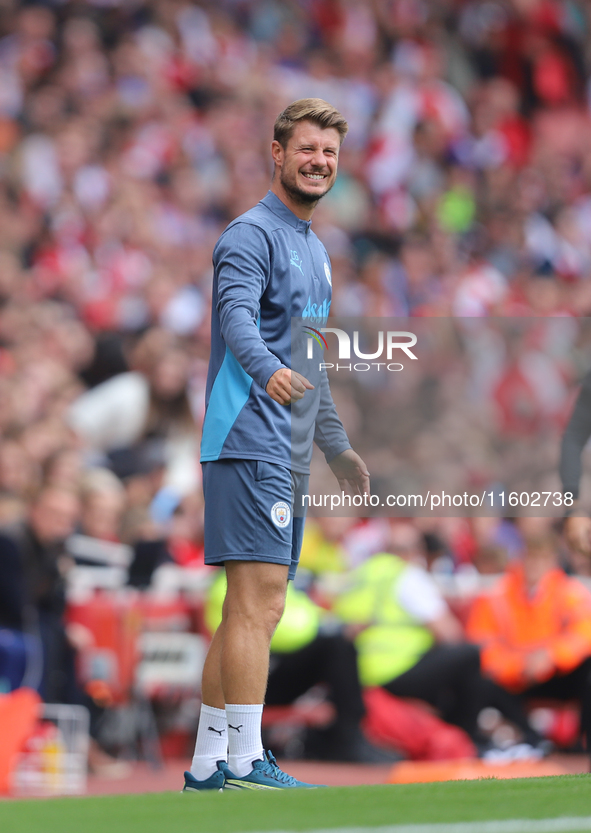 Manchester City coaching staff during the Barclays FA Women's Super League match between Arsenal and Manchester City at the Emirates Stadium...