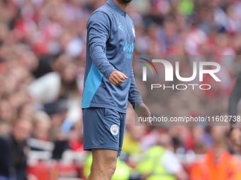 Manchester City coaching staff during the Barclays FA Women's Super League match between Arsenal and Manchester City at the Emirates Stadium...