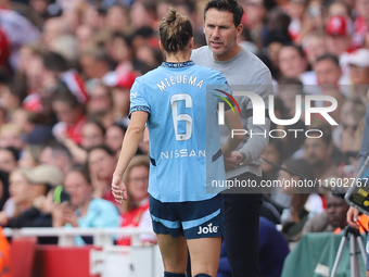 Vivianne Miedema embraces the manager Gareth Taylor during the Barclays FA Women's Super League match between Arsenal and Manchester City at...