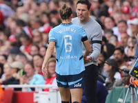 Vivianne Miedema embraces the manager Gareth Taylor during the Barclays FA Women's Super League match between Arsenal and Manchester City at...