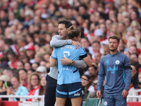 Vivianne Miedema embraces the manager Gareth Taylor during the Barclays FA Women's Super League match between Arsenal and Manchester City at...