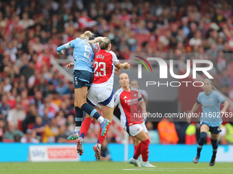 Alex Greenwood and Alessia Russo jump for the ball during the Barclays FA Women's Super League match between Arsenal and Manchester City at...