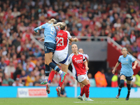 Alex Greenwood and Alessia Russo jump for the ball during the Barclays FA Women's Super League match between Arsenal and Manchester City at...