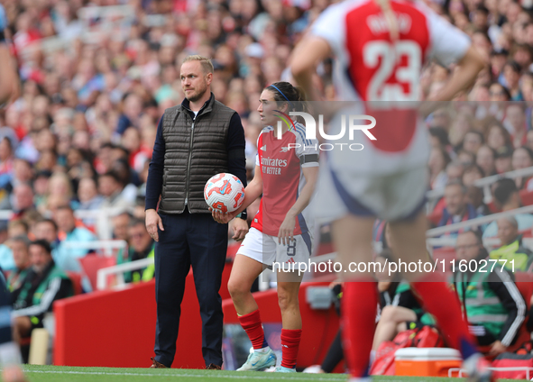 Jonas Eidevall is unhappy at the throw-in after being challenged by a Manchester City player during the Barclays FA Women's Super League mat...