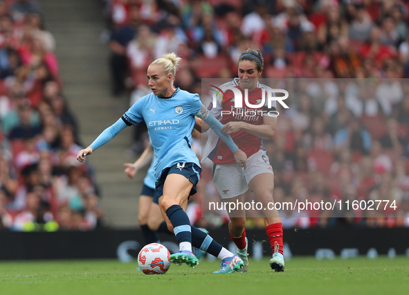 Rosa Kafaji challenges Alex Greenwood during the Barclays FA Women's Super League match between Arsenal and Manchester City at the Emirates...