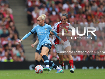 Rosa Kafaji challenges Alex Greenwood during the Barclays FA Women's Super League match between Arsenal and Manchester City at the Emirates...