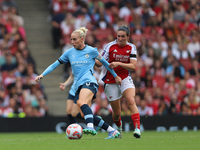 Rosa Kafaji challenges Alex Greenwood during the Barclays FA Women's Super League match between Arsenal and Manchester City at the Emirates...