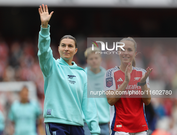 Steph Catley and Lia Walti thank fans after the Barclays FA Women's Super League match between Arsenal and Manchester City at the Emirates S...