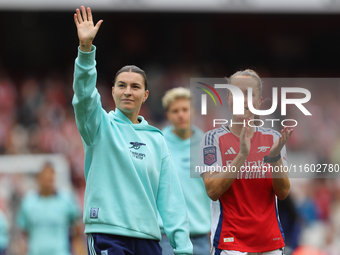 Steph Catley and Lia Walti thank fans after the Barclays FA Women's Super League match between Arsenal and Manchester City at the Emirates S...