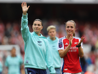 Steph Catley and Lia Walti thank fans after the Barclays FA Women's Super League match between Arsenal and Manchester City at the Emirates S...