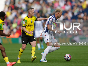 Uros Racic of West Bromwich Albion in action with Adam Forshaw of Plymouth Argyle during the Sky Bet Championship match between West Bromwic...