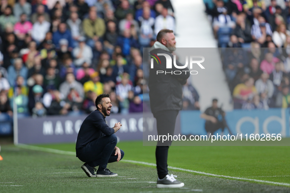 West Bromwich Albion's manager Carlos Corberan kneels during the Sky Bet Championship match between West Bromwich Albion and Plymouth Argyle...